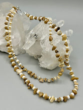 Load image into Gallery viewer, This natural bamboo, bone, and gold glass beaded necklace is the perfect piece to add versatility to any outfit. The neutral colors blend easily with any look and will give your outfit an unforgettable look. Measurements:   Necklace: 15&quot; - can be adjusted up to 16&quot;
