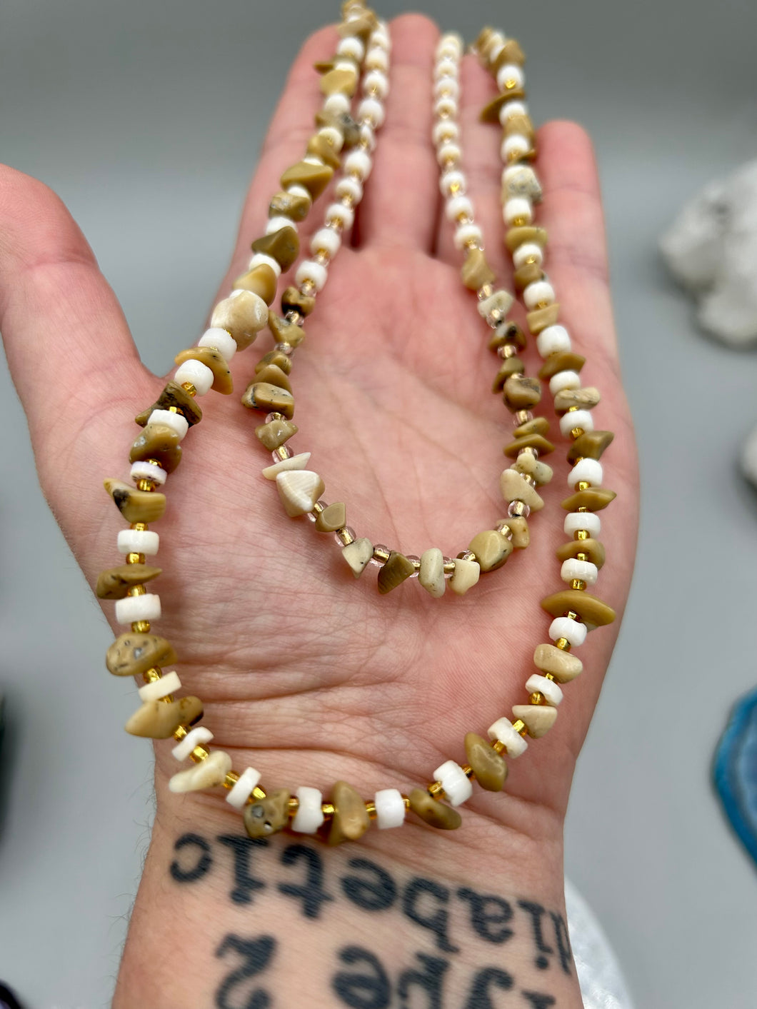 This natural bamboo, bone, and gold glass beaded necklace is the perfect piece to add versatility to any outfit. The neutral colors blend easily with any look and will give your outfit an unforgettable look. Measurements:   Necklace: 15