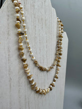 Load image into Gallery viewer, This natural bamboo, bone, and gold glass beaded necklace is the perfect piece to add versatility to any outfit. The neutral colors blend easily with any look and will give your outfit an unforgettable look. Measurements:   Necklace: 15&quot; - can be adjusted up to 16&quot;
