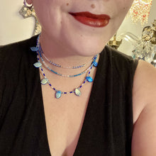 Load image into Gallery viewer, This exquisite Winter Frost Nature Inspired Jewelry has all your style needs covered. A detailed, glass beaded necklace featuring an array of blues, silver and gold tones adorns your neck to add a touch of elegance to any look. Effortlessly dress it up or down to complement any ensemble.  Measurements:  Necklace is 14” in length, can be adjusted up to 18"
