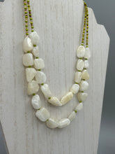 Load image into Gallery viewer, This exquisite necklace features large natural Calcite beads complemented by Wasabi Green glass beads. Two strands of neutral colors bring a sophisticated look that can dress up or dress down any outfit for a one-of-a-kind style.    Measurements:    Necklace is 17 1/4 &quot; in length adjustable to 18 1/2&quot;
