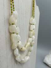 Load image into Gallery viewer, This exquisite necklace features large natural Calcite beads complemented by Wasabi Green glass beads. Two strands of neutral colors bring a sophisticated look that can dress up or dress down any outfit for a one-of-a-kind style.    Measurements:    Necklace is 17 1/4 &quot; in length adjustable to 18 1/2&quot;

