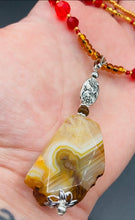 Load image into Gallery viewer, The Vibrant Yellow Agate Natural Stone Red Gold Beaded Choker Style Necklace is a fierce and bold statement piece. Featuring three strands of multi-color glass beads and a mixture of red and gold beads, this jewelry is a perfect addition to any collection. For a complete look, the merchant has created matching earrings. Necklace is 15” in length adjustable to 18" in length. Earrings are 1” length
