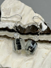 Load image into Gallery viewer, This striking set of earrings features large square-shaped clear glass beads adorned with black-and-white designs. Neutral-hued stone beads lend a cool feel, making them both unique and versatile. Measurements: 1 1/4” in length
