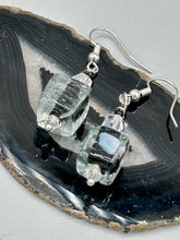 Load image into Gallery viewer, This striking set of earrings features large square-shaped clear glass beads adorned with black-and-white designs. Neutral-hued stone beads lend a cool feel, making them both unique and versatile.  Measurements: 1 1/4” in length
