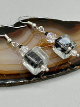 Load image into Gallery viewer, This striking set of earrings features large square-shaped clear glass beads adorned with black-and-white designs. Neutral-hued stone beads lend a cool feel, making them both unique and versatile.  Measurements: 1 1/4” in length
