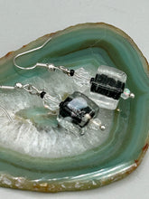 Load image into Gallery viewer,  This striking set of earrings features large square-shaped clear glass beads adorned with black-and-white designs. Neutral-hued stone beads lend a cool feel, making them both unique and versatile. Measurements: 1 1/4” in length
