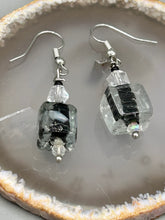 Load image into Gallery viewer, This striking set of earrings features large square-shaped clear glass beads adorned with black-and-white designs. Neutral-hued stone beads lend a cool feel, making them both unique and versatile. Measurements: 1 1/4” in length
