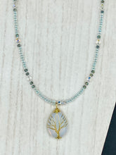 Load image into Gallery viewer, This opalite stone pendant with its shimmering hues of blue, gold, and pink is inspired by the whimsical beauty of nature. I created a beaded necklace using iridescent glass beads with the same colors of blue, gold, and pink to enhance the look of the Vibrant Tree Of Life Opalite Wired Stone Pendant. Measurements: Necklace is 20”
