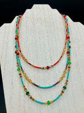 Load image into Gallery viewer,  Vibrant And Enchanting Southwestern Style Jewelry. Colorful and bold three strand turquoise, bright and dark reds and greens, golds and yellows glass beads. 

