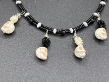 Load image into Gallery viewer, This sophisticated, yet dark-themed necklace utilizes small howlite skull beads along with black and white quartize floral beads to capture the iconic floral crown of Frida Kahlo. This Chingona, Cabrona, Latina Chicana, Goth, Vampire Goth, Dark Witchy Style jewelry can be used to inspire and to celebrate Dia de los Muertos. Equally suitable for dressy and casual outfits, the piece gives a unique edge to any look.
