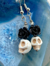 Load image into Gallery viewer, This sophisticated, yet dark-themed necklace utilizes small howlite skull beads along with black and white quartize floral beads to capture the iconic floral crown of Frida Kahlo. This Chingona, Cabrona, Latina Chicana, Goth, Vampire Goth, Dark Witchy Style jewelry can be used to inspire and to celebrate Dia de los Muertos. Equally suitable for dressy and casual outfits, the piece gives a unique edge to any look.

