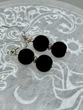 Load image into Gallery viewer, These two-bead flat matte black glass earrings are perfect for any look. With their subtle yet elegant design, they are a great accessory for any closet. 1 1/4” in length
