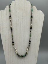 Load image into Gallery viewer, This exquisite necklace features natural ruby zoisite, snowflake obsidian, turquoise magnesite, bone, glass and metal beads, offering a variety of sizes, shapes, textures, and colors.
