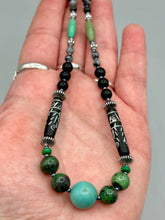 Load image into Gallery viewer, This necklace boasts a diverse selection of natural bead materials, including ruby zoisite, black and snowflake obsidian stones, plus turquoise magnesite, bone, glass and metal beads. This variety of sizes, shapes, textures and colors will make this necklace stand out.    Measurements:  Necklace - 23&quot; in length
