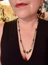 Load image into Gallery viewer, This exquisite necklace features natural ruby zoisite, snowflake obsidian, turquoise magnesite, bone, glass and metal beads, offering a variety of sizes, shapes, textures, and colors.
