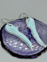 Load image into Gallery viewer, Light baby blue wings earrings made of polymer clay.  These earrings are designed to face forward when worn instead of the front wings showing on the side.
