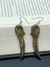 Load image into Gallery viewer, Sparkling gold tone angel wings earrings made of polymer clay.  These earrings are designed to face forward when worn instead of the front wings showing on the side.
