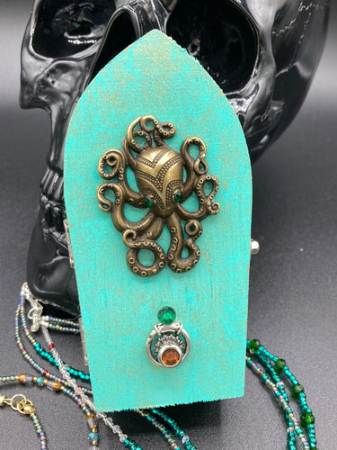 Handmade Steampunk Inspired Wood Coffin Jewelry Box | Metal Brass Octopus With Green Eyes Embellishment Coffin Ring Box. Interior lined with mandala pattern fabric. Vintage Victorian Style Inspired.  Handmade Unique Jewelry Box, Holds several rings or jewelry pieces. Perfect Dark, Beautiful, Unique Gift for the BOLD. Makes a great keepsake box. Or you could also just let your cat admire it before he knocks it off the table, too.