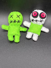 Load image into Gallery viewer, Mini Lime Green And White Voodoo Doll stands at 3 1/2&quot; in height.  Torso is lime green with arms, legs and head is all white.  He has dark red buttons for eyes.  Adorable but with a dash of creepy.  Beetlejuice inspired Lime Green Voodoo Doll stands at 3 1/4&quot; in height.  All lime green with “x” for eyes and mouth sowed shut.  Super spooky but still cute doll.
