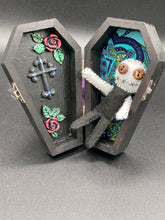 Load image into Gallery viewer,  Skinny black and white Voodoo Doll stands at 3 7/8&quot; in height. Black torso and legs with white arm and head.  Stylish brown buttons for eyes, but his lips are sowed shut of course.
