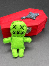 Load image into Gallery viewer, Beetlejuice inspired Lime Green Voodoo Doll stands at 3 1/4&quot; in height.  All lime green with “x” for eyes and mouth sowed shut.  Super spooky but still cute doll.
