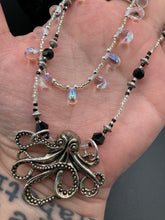 Load image into Gallery viewer, This Steampunk Metal Octopus Double Strand Bead Adjustable Necklace is a stylish and unique addition to any collection. Crafted with vivid iridescent teardrop and glass beads, this stylish jewelry also features a highly detailed metal octopus pendant. Strands of beads are designed to interweave without tangling for a truly eye-catching look.   Measurements:  Necklace measures 16 1/2” adjustable up to 18”
