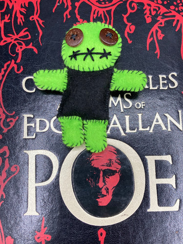Black And Green Voodoo Doll stand at 3 3/8