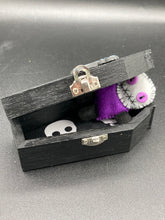 Load image into Gallery viewer, Mini socially awkward black and purple Voodoo Doll stands at 2 3/4&quot; in height.  He has a bright purple torso with black limbs and a large white head and matching purple biddy eyes.  
