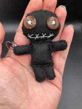 Load image into Gallery viewer, All black Voodoo Doll stands at 3&quot; in height.  Like a creepy all black shadow, he has brown buttons for eyes to better to see you with.
