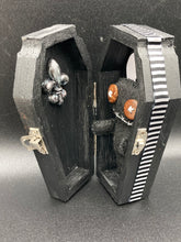 Load image into Gallery viewer, All black Voodoo Doll stands at 3&quot; in height.  Like a creepy all black shadow, he has brown buttons for eyes to better to see you with.

