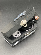 Load image into Gallery viewer, All black Voodoo Doll stands at 3&quot; in height.  Like a creepy all black shadow, he has brown buttons for eyes to better to see you with.
