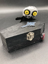 Load image into Gallery viewer,  Creepy black and white Voodoo Doll stands tall at 4&quot; in height.  He’s all black like a shadow but has a round white head.  Bright yellow buttons eyes are perfect to see you better with.
