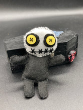 Load image into Gallery viewer,  Creepy black and white Voodoo Doll stands tall at 4&quot; in height.  He’s all black like a shadow but has a round white head.  Bright yellow buttons eyes are perfect to see you better with.
