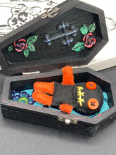 Load image into Gallery viewer, Short and tiny black and orange Voodoo Doll is 3&quot; in height.  Torso and head is all black while legs and arms are bright orange, perfect Halloween colors. He has matching bright orange buttons for eyes and has a sowed shut mouth.
