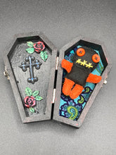 Load image into Gallery viewer, Short and tiny black and orange Voodoo Doll is 3&quot; in height.  Torso and head is all black while legs and arms are bright orange, perfect Halloween colors. He has matching bright orange buttons for eyes and has a sowed shut mouth.
