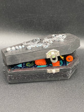 Load image into Gallery viewer, Short and tiny black and orange Voodoo Doll is 3&quot; in height.  Torso and head is all black while legs and arms are bright orange, perfect Halloween colors. He has matching bright orange buttons for eyes and has a sowed shut mouth.
