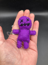 Load image into Gallery viewer, Purple Voodoo Doll stands at 3 3/4&quot; in height.  He has sowed mouth and eye shut so that make him creepy.
