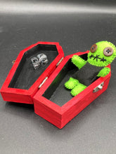 Load image into Gallery viewer, Black And Green Voodoo Doll stand at 3 3/8&quot; in height. Torso is black, while his arms, legs and head is all lime green.  He has stylish brown buttons for eyes.  Adorable but with a dash of creepy.
