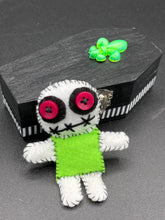Load image into Gallery viewer, Mini Lime Green And White Voodoo Doll stands at 3 1/2&quot; in height.  Torso is lime green with arms, legs and head is all white.  He has dark red buttons for eyes.  Adorable but with a dash of creepy.
