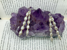 Load image into Gallery viewer, Two long strands of simulated white baroque pearls and silver glass beads come together to create this exquisite accessory.  Measurements: 2” in length 
