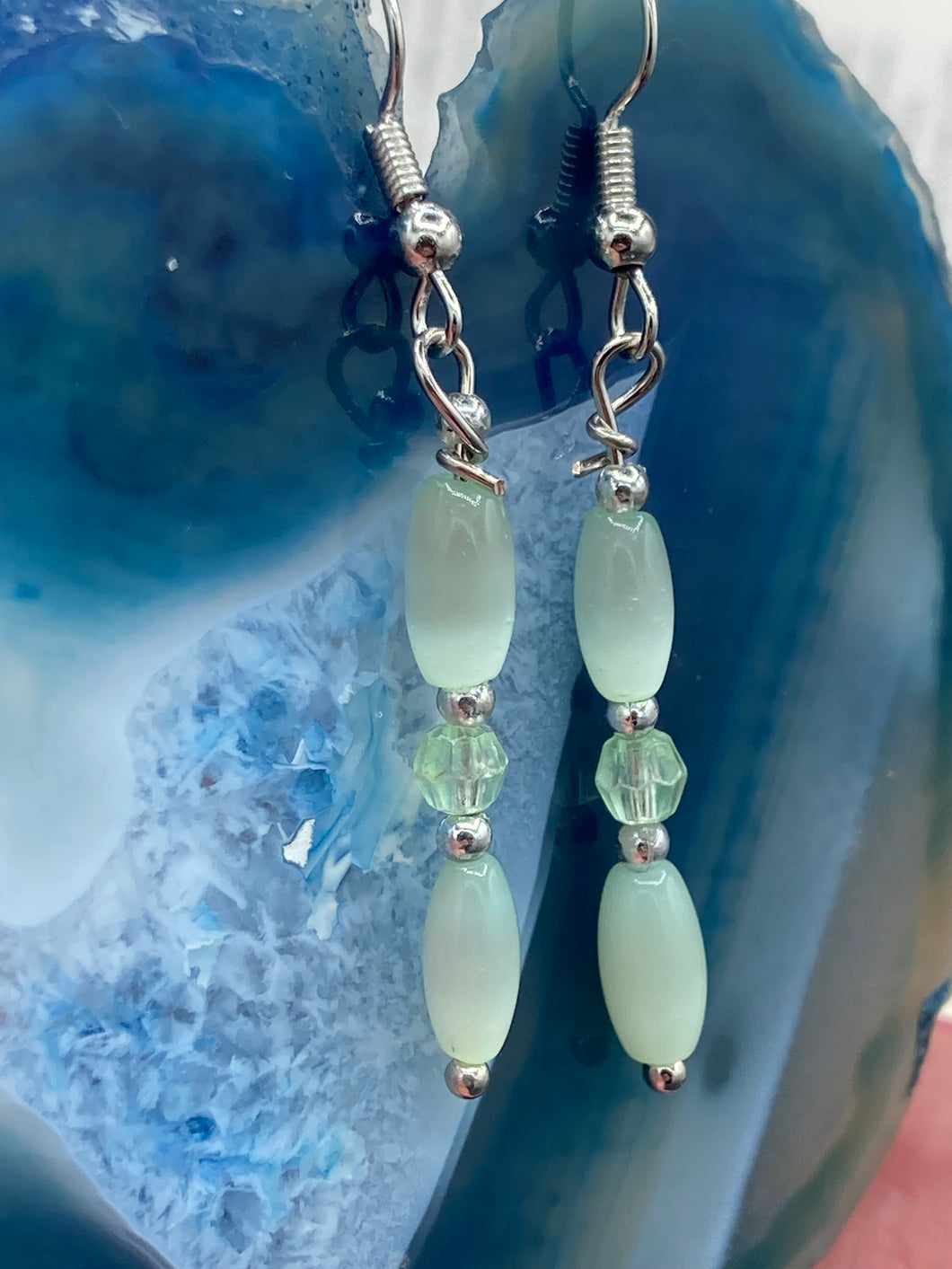 Dainty pastel green glass beaded earringsThese dainty pastel green glass beaded earrings add a unique and eye-catching touch to any look, making them the perfect bohemian accessory. Their shabby boho chic design is both comfortable and elegant, making them the ideal choice for any occasion. Measurements: 1 1/4” in length 