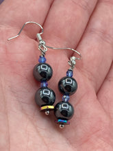 Load image into Gallery viewer, These chic earrings, crafted with two Hematite beads and blue glass beads, provide a stylish accent.  Measurements: 1 1/4” in length
