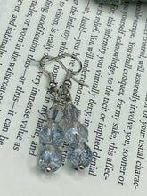 Load image into Gallery viewer, These gorgeous earrings boast three shimmering beads of round iridescent and silver glass.  Measurements: 1 1/4” in length
