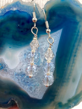 Load image into Gallery viewer, These gorgeous earrings boast three shimmering beads of round iridescent and silver glass.  Measurements: 1 1/4” in length
