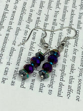 Load image into Gallery viewer, These rainbow hematite and dark purple glass beaded earrings are the ideal accessory for bohemian summer looks, providing a touch of chic elegance to hippie and nature-inspired styles.  Measurements: 1” in length
