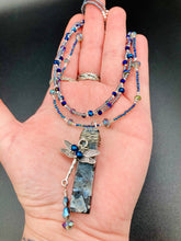 Load image into Gallery viewer, This stunning rectangular-shaped Black Labradorite Stone necklace features a wire-wrapped dragonfly pendant, completed with intricate glass bead detailing. Perfect for a summer night, it will make a bold statement.  Measurements: Necklace is 16” adjustable up to 18&quot;
