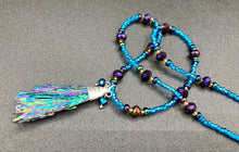 Load image into Gallery viewer, Rainbow Kyanite Wired Stone With Multi-Color Glass Beads Necklace. I used a combination of deep purples, turquoise blues, and golds to really capture the essence of this celestial galaxy stone. This beautiful necklace and rainbow kyanite pendant is a must have jewelry piece to add to your collection.  Measurements: Necklace is 16” adjustable up to 18&quot; in length - pendant is 2” Height
