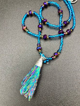 Load image into Gallery viewer, Rainbow Kyanite Wired Stone With Multi-Color Glass Beads Necklace. I used a combination of deep purples, turquoise blues, and golds to really capture the essence of this celestial galaxy stone. This beautiful necklace and rainbow kyanite pendant is a must have jewelry piece to add to your collection.  Measurements: Necklace is 16” adjustable up to 18&quot; in length - pendant is 2” Height
