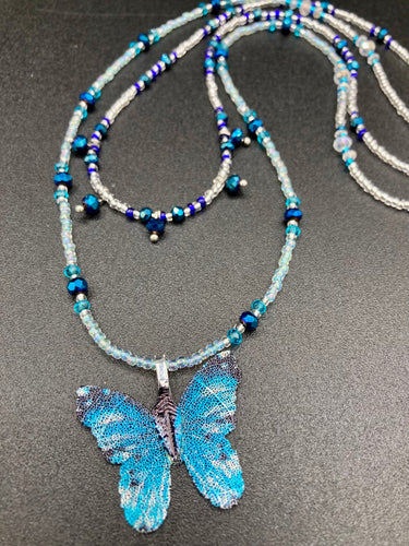 This Sterling Silver Bright Sky Blue and Silver Butterfly Pendant is detailed with a basil leaf motif. With vibrant hues of blue and silver, the pendant is complimented by multi-color glass beads to create the ideal summer jewelry piece.  Measurements:  Necklace is 16 1/2”adjustable up to 18